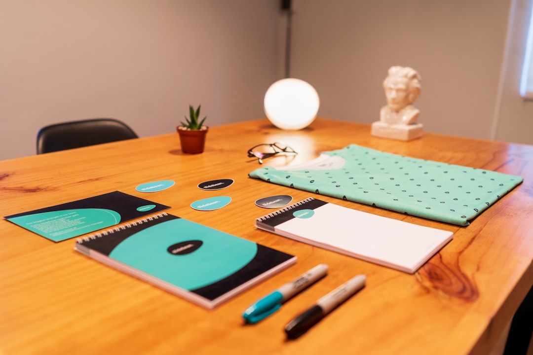 services-01 blue-and-black-click-pen-on-brown-wooden-table-y1efzwi1xyu